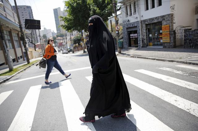 ​Thủ tướng Đức tán thành cấm mang mạng che mặt - 0