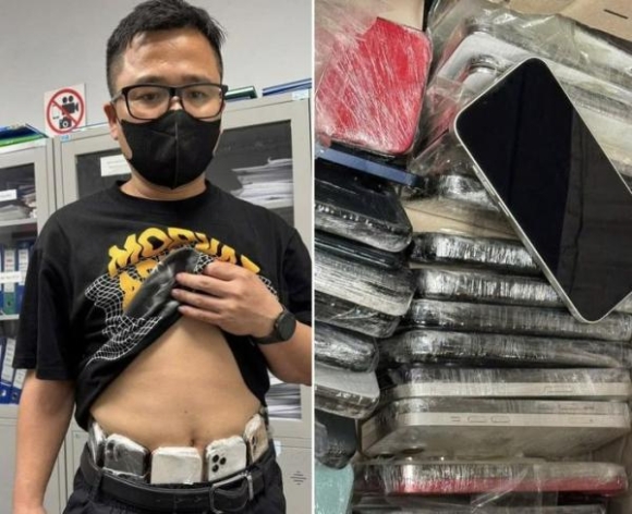 1 Nguoi Dan Ong Bang Bo 64 Chiec Dien Thoai Quanh Nguoi Nhap Canh Noi Bai